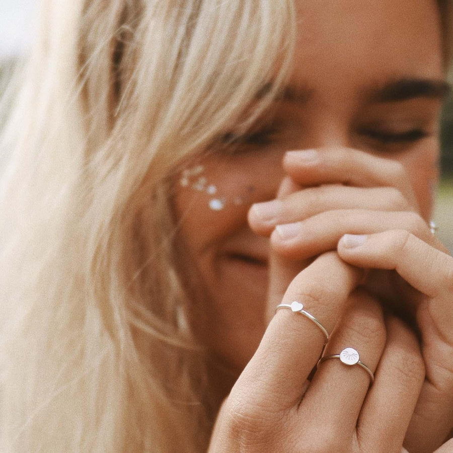 Woman with blonde hair wearing Sterling silver rings