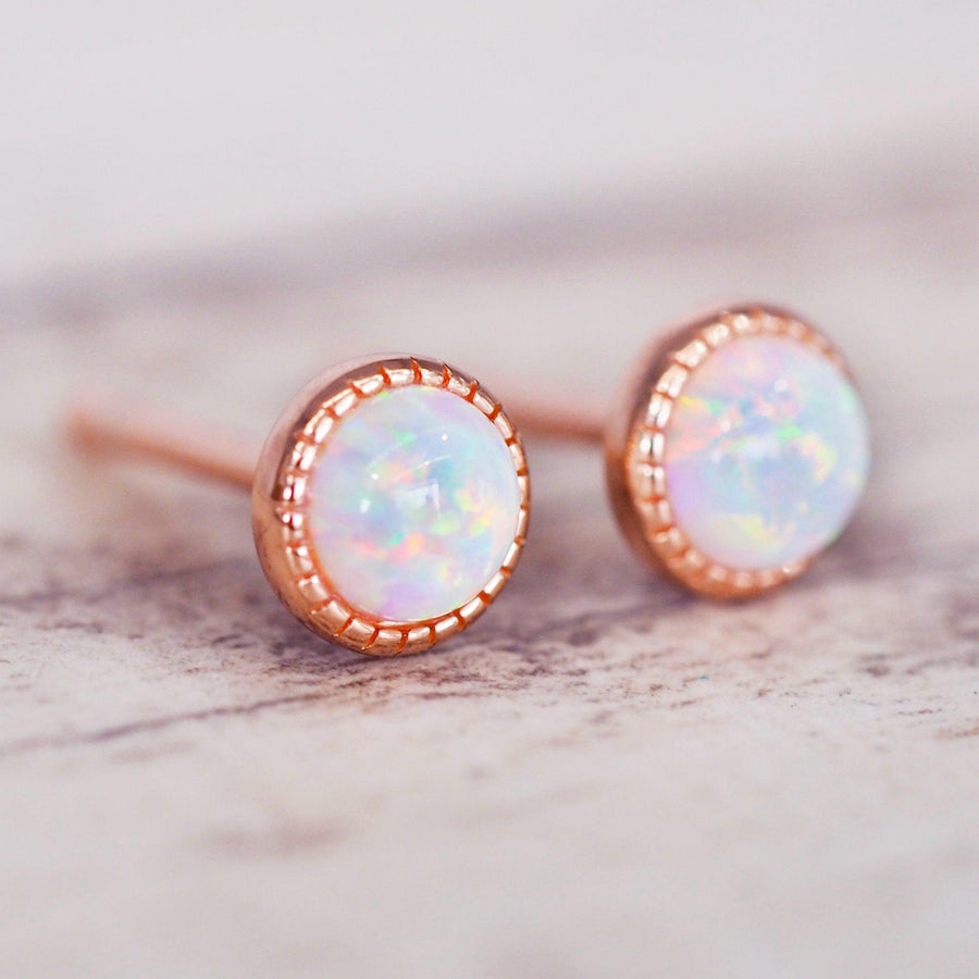 dainty rose gold earrings with opals shining with rainbow colours - womens jewellery by indie and harper