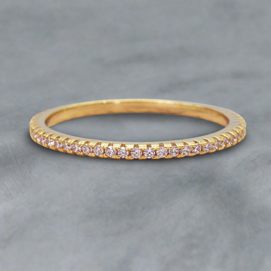 gold ring adorned with cubic zirocnias around the band - womens gold promise rings australia