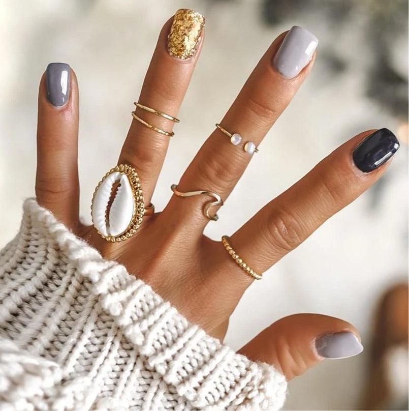 Hand wearing Gold Rings - womens gold jewellery by indie and harper