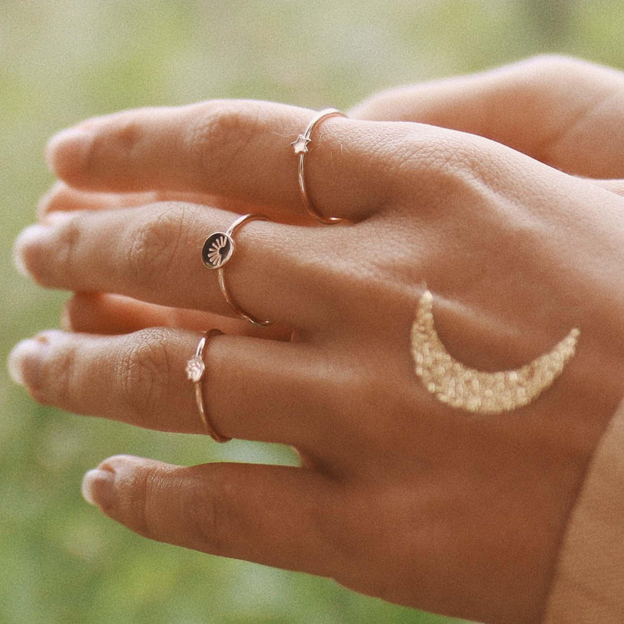 Woman with gold temporary tattoo on her hand and wearing Dainty Gold Rings - womens gold jewellery Australia by indie and harper