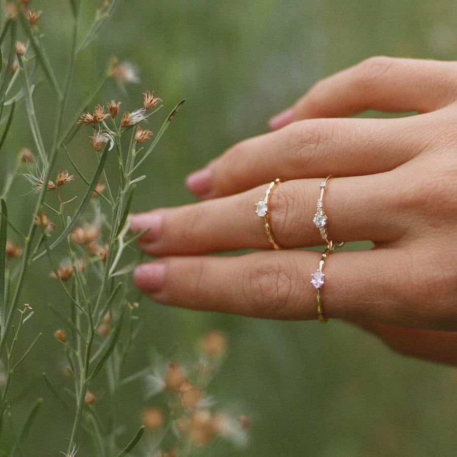 Woman wearing dainty gold rose quartz rings - women’s jewellery Australia 