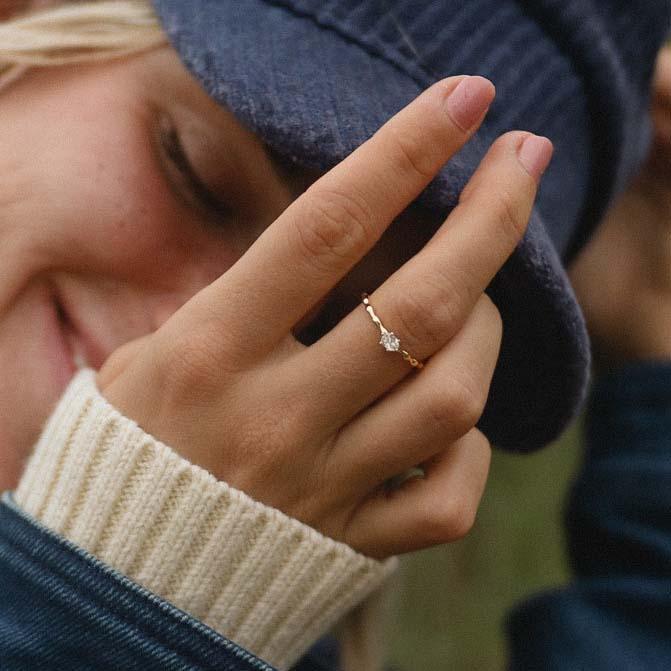 Woman wearing her Dainty Gold Ring with white topaz crystal - womens gold jewellery by indie and harper