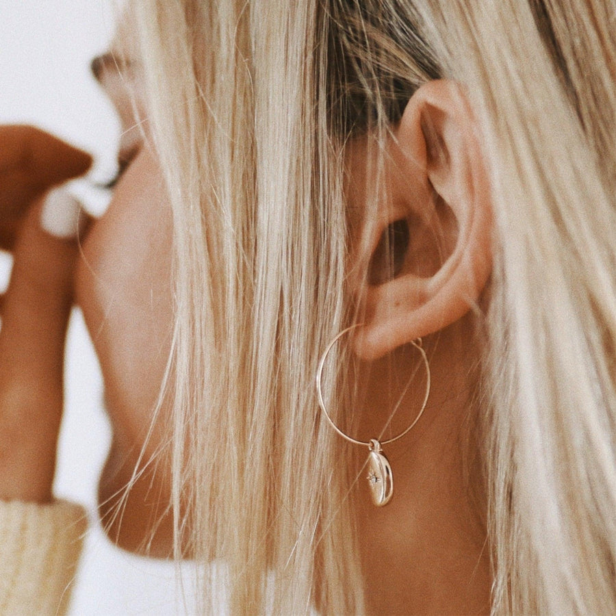 Woman with blonde hair wearing Gold Earrings - gold jewellery - Australian jewellery online