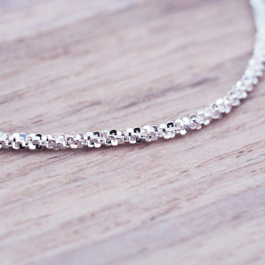 Close up of Sterling Silver Bracelet on a piece of wood - womens jewellery by indie and harper