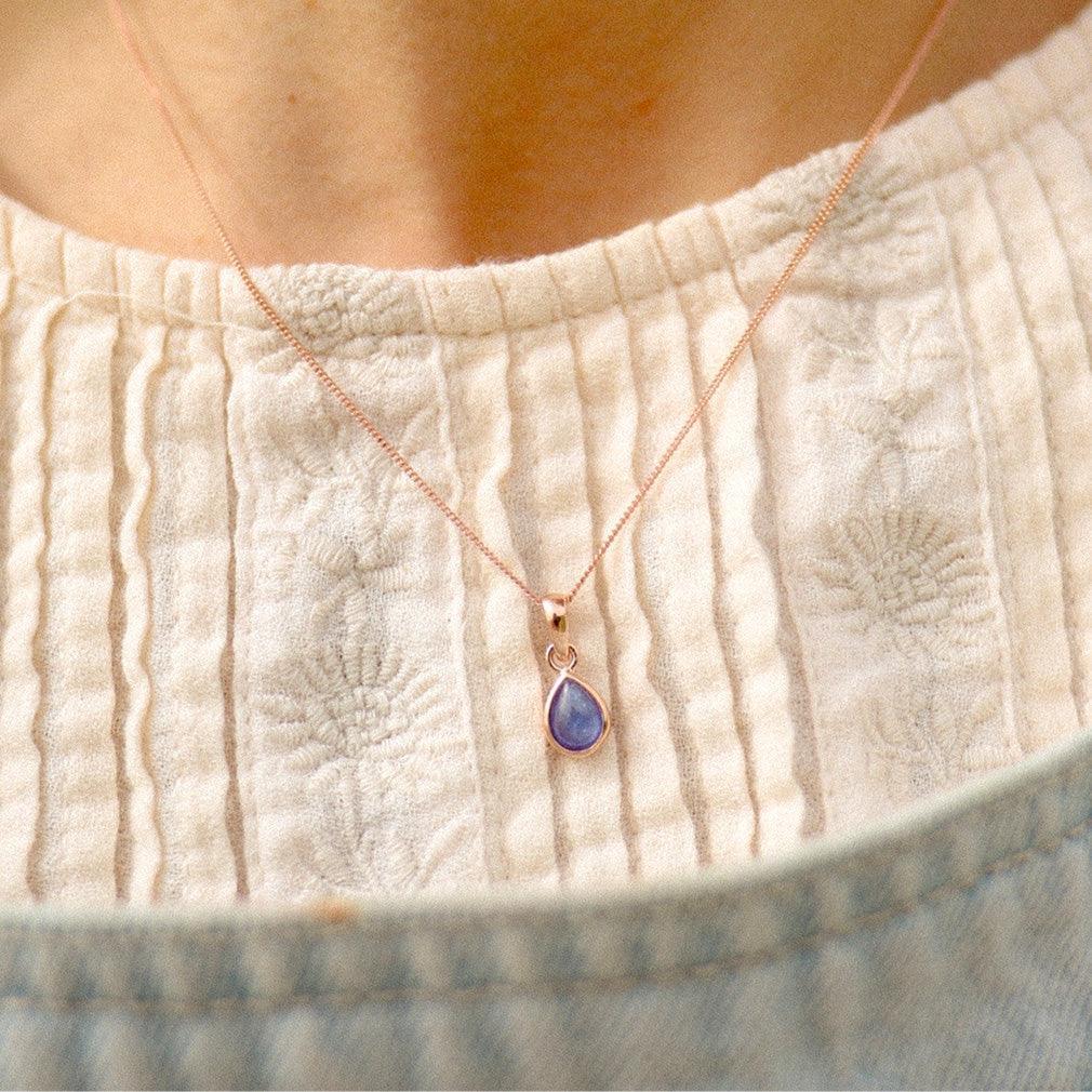 indie and harper Gold December tanzanite Necklace being worn