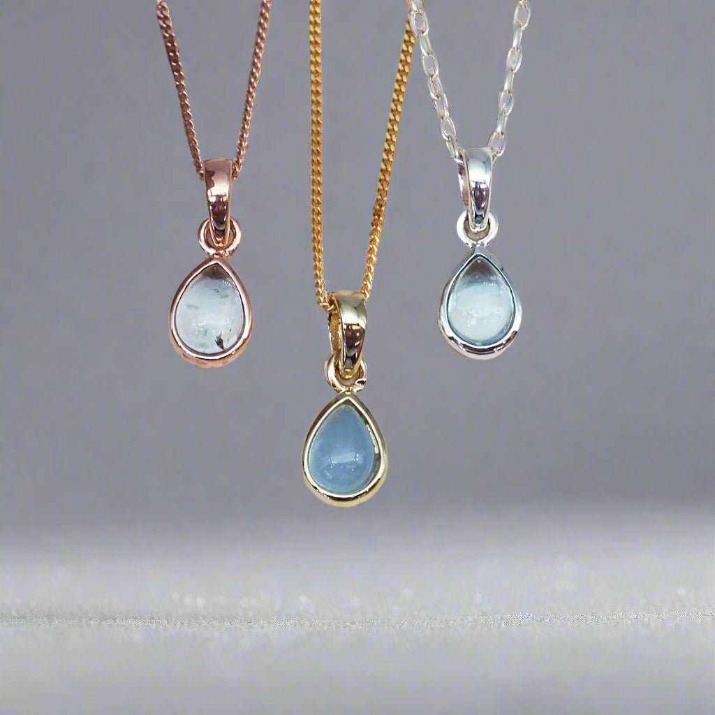 indie and harper November birthstone blue topaz necklaces in rose gold, gold and silver