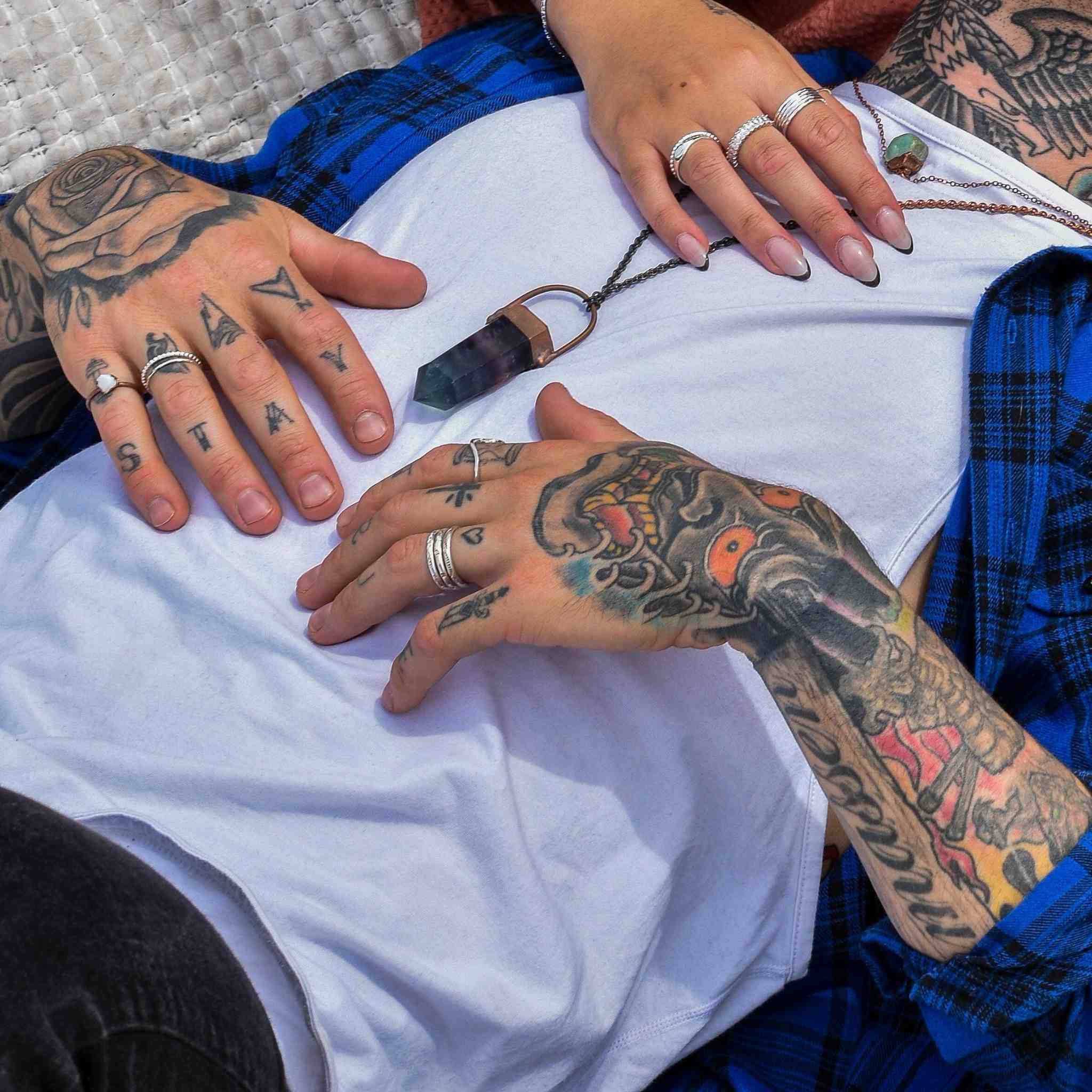 Silver Hand Carved Navajo Ring being worn by man with tattoos by indie and harper australia