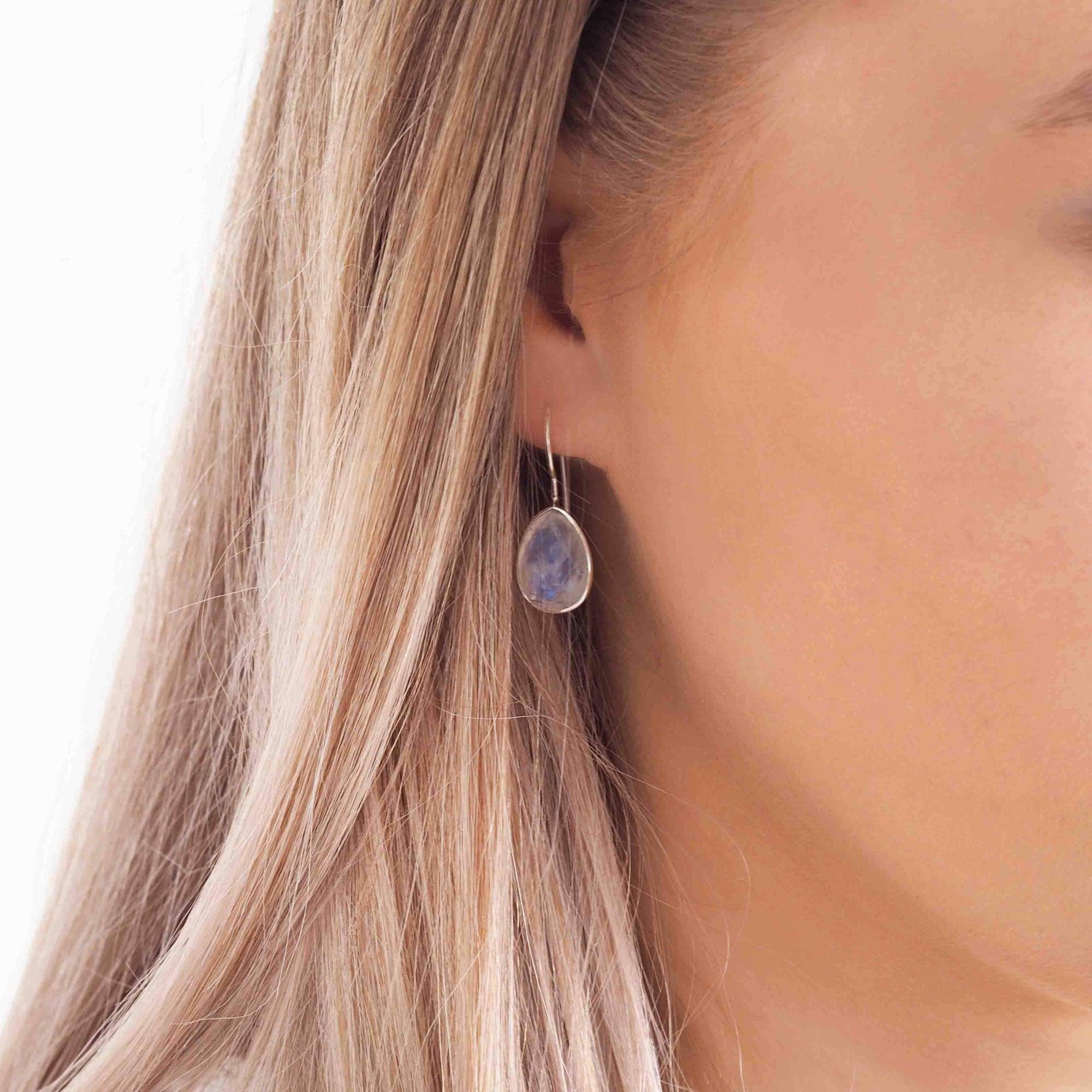 Woman with blonde hair wearing Silver Moonstone Earrings - indie and harper australia