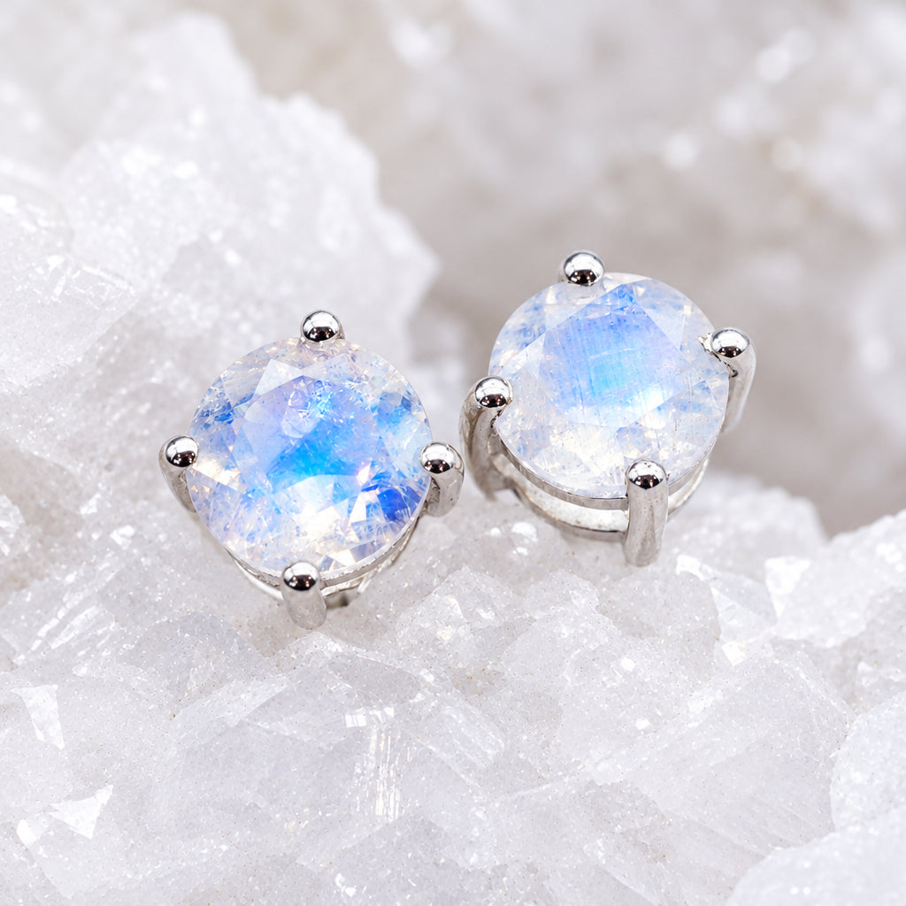 Sterling silver moonstone stud earrings with round faceted claw-set stones