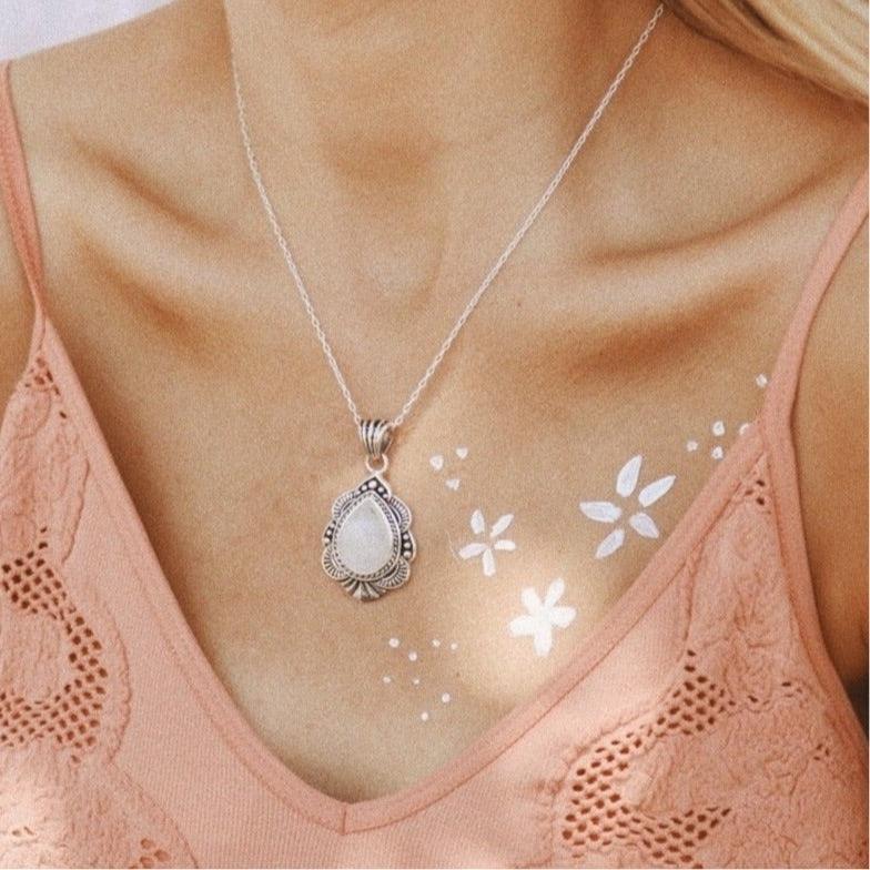Woman in peach singlet wearing a Moonstone Necklace - sterling silver necklaces