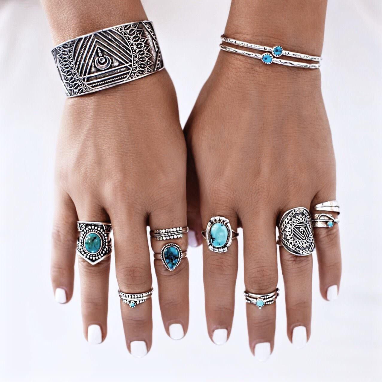 woman wearing sterling silver turquoise rings and turquoise bracelets by indie and harper