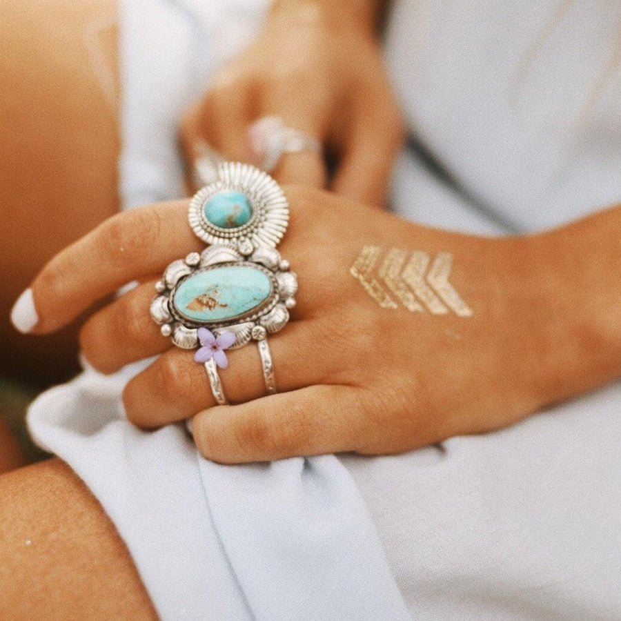 woman wearing statement turquoise rings - sterling silver turquoise jewellery