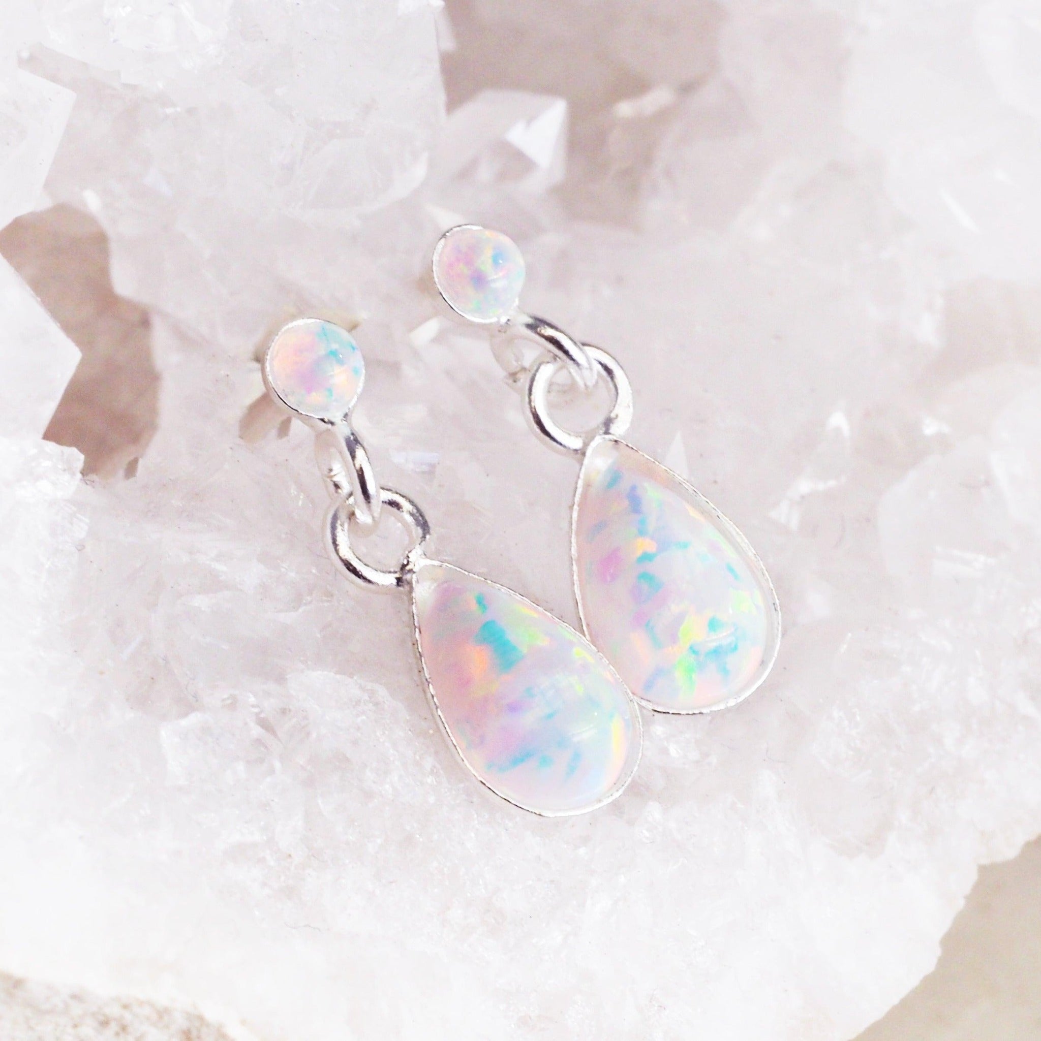 white Opal Earrings sitting on a crystal - opal jewellery by Australian jewellery brands indie and harper 
