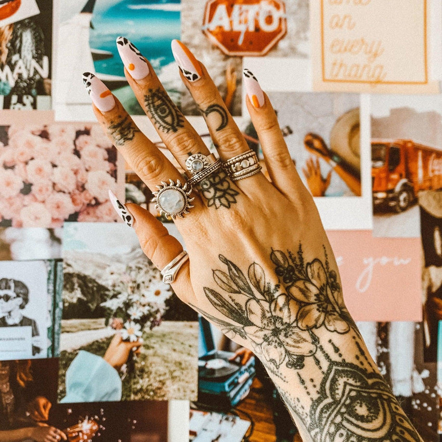 Moonstone Rings worn on woman’s tattooed hand - womens moonstone jewellery by indie and harper