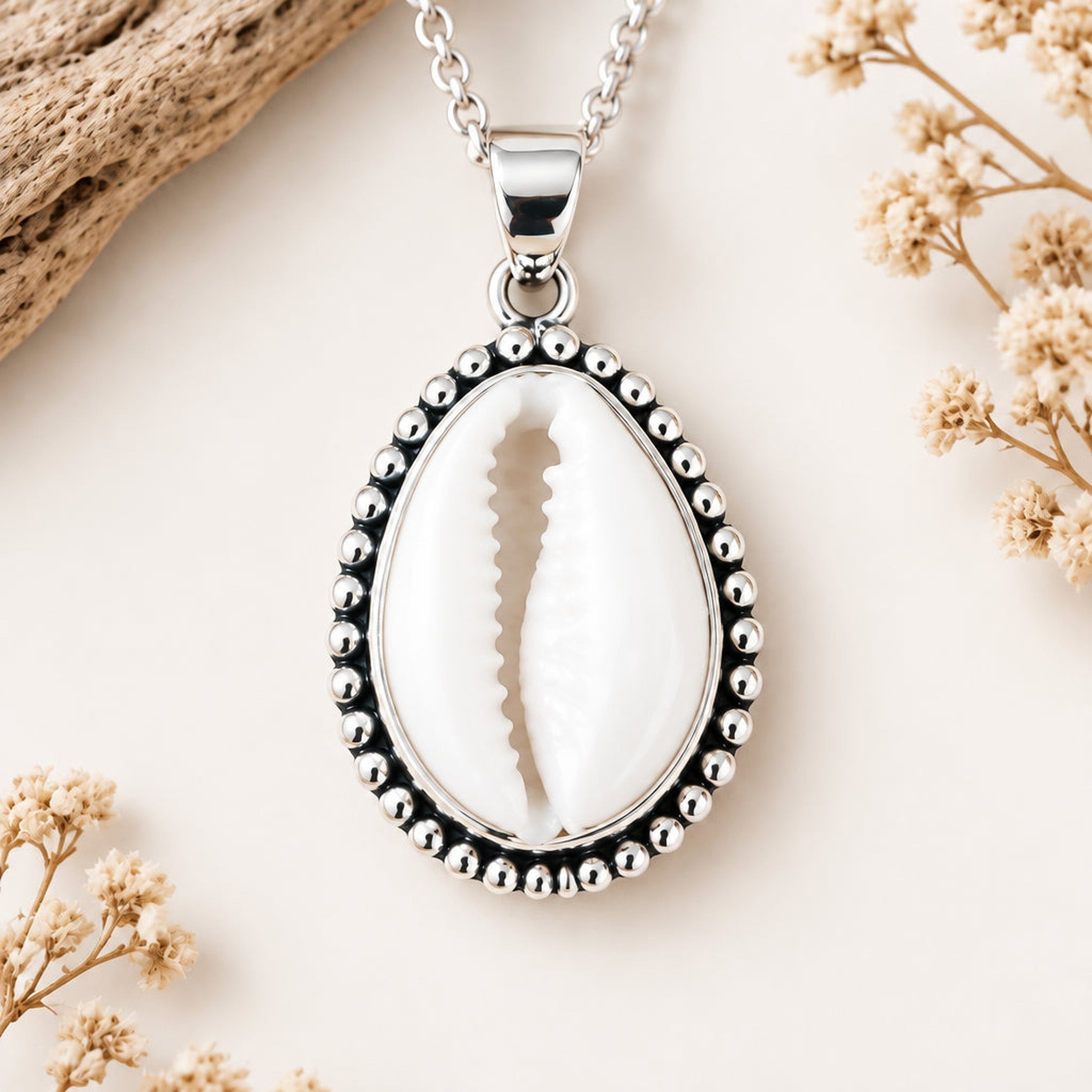 Sterling silver cowrie shell necklace, close-up