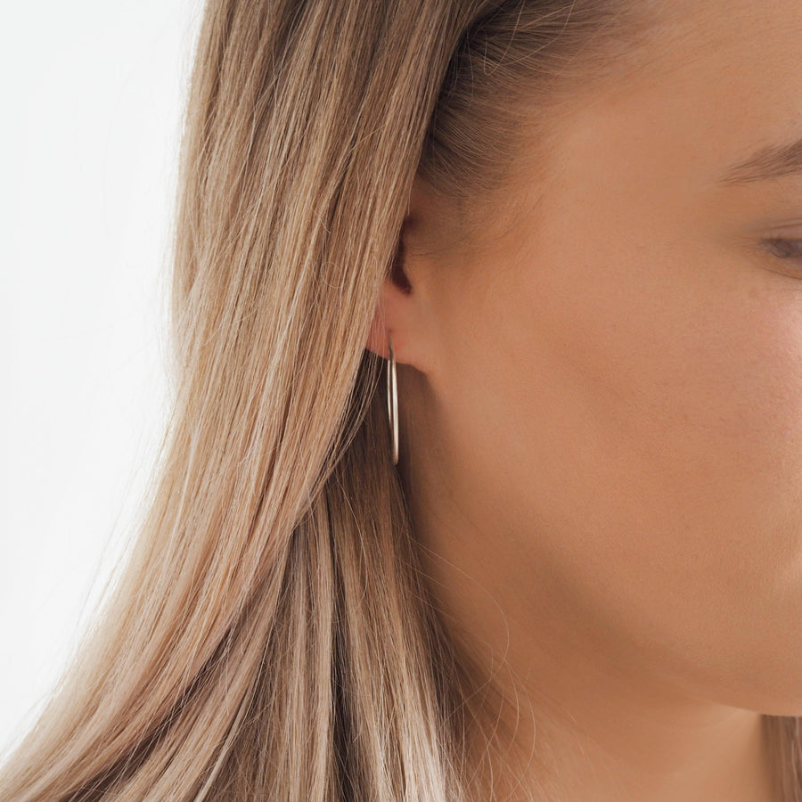 Woman wearing Silver Hoop Earrings - womens silver earrings by Australian jewellery brand online 