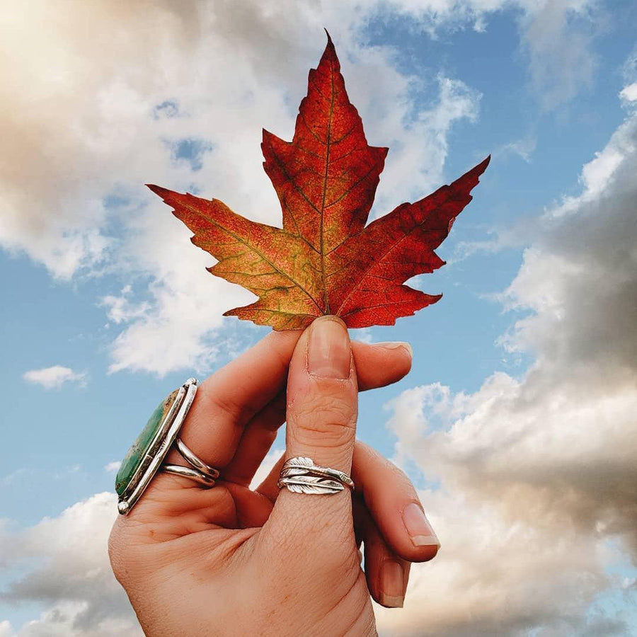 Hand holding maple leaf wearing Silver Navajo Rings - womens sterling silver jewellery by indie and harper