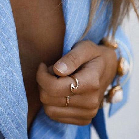 Woman with blue jacket wearing Solid Gold Rings - solid gold jewellery by womens jewelry brand indie and harper
