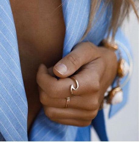 Woman with blue jacket wearing Solid Gold Rings - solid gold jewellery by womens jewelry brand indie and harper