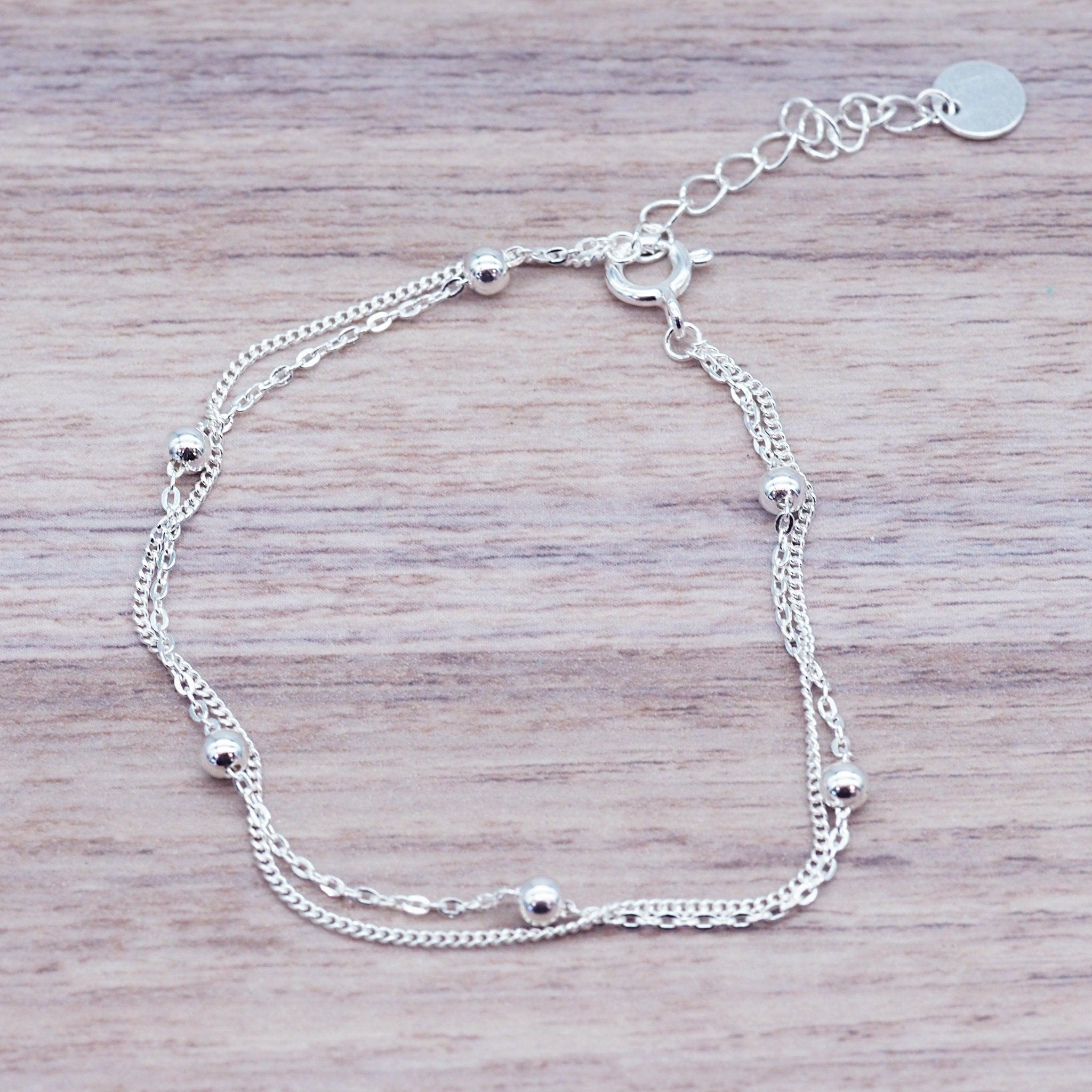 Sterling Silver Bracelet on a piece of wood - womens jewellery by Australian jewellery brands online indie and harper