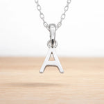 925 sterling silver initial A necklace hanging on a fine chain