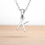 dainty sterling silver initial k necklace on a dainty chain
