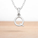 sterling silver initial q pendant on a dainty sterling silver chain