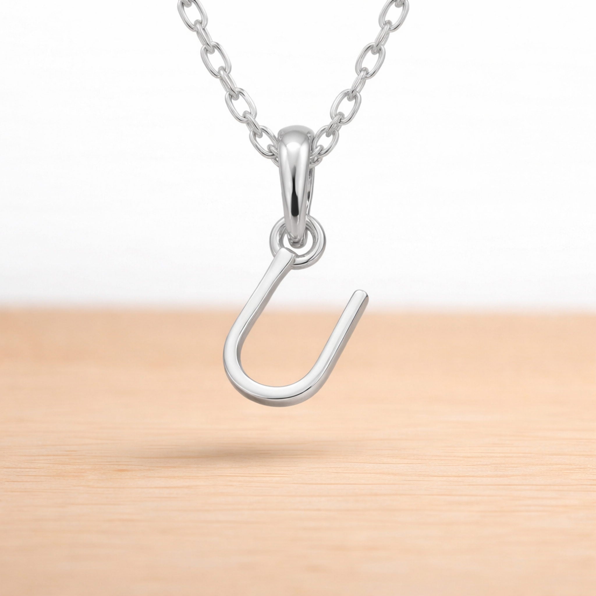 sterling silver initial u pendant on a dainty sterling silver chain 