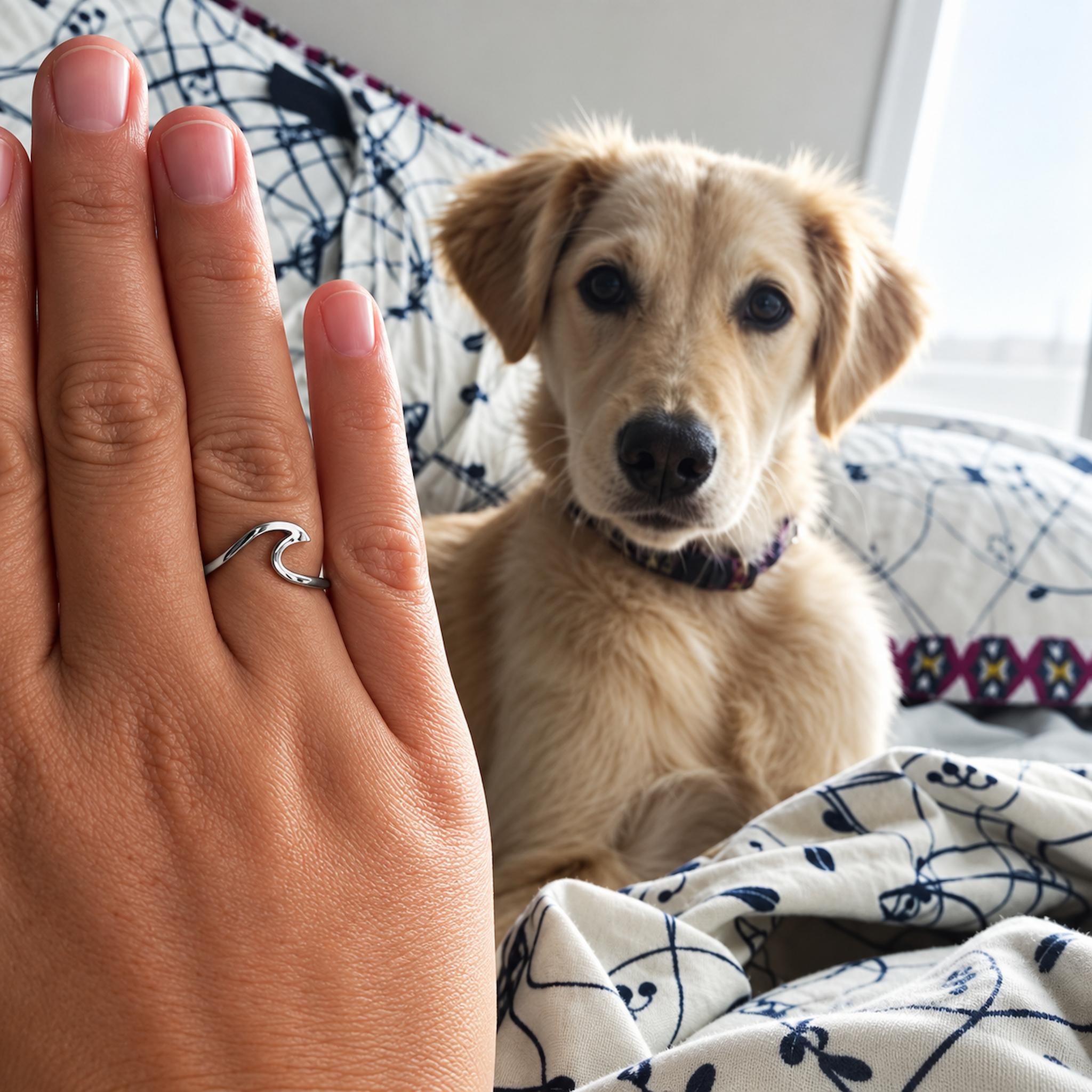 sterling silver wave ring being worn with cute dog in the background