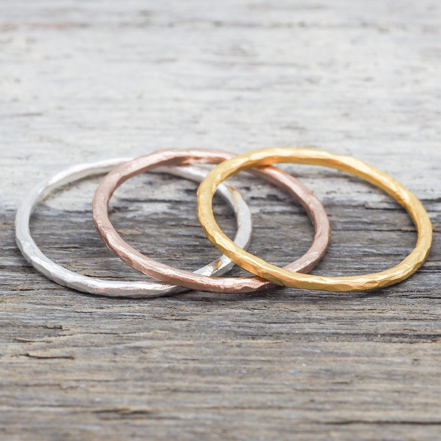 Sterling silver, rose gold and gold Stacker Rings on a piece of wood - Australian jewellery brand
