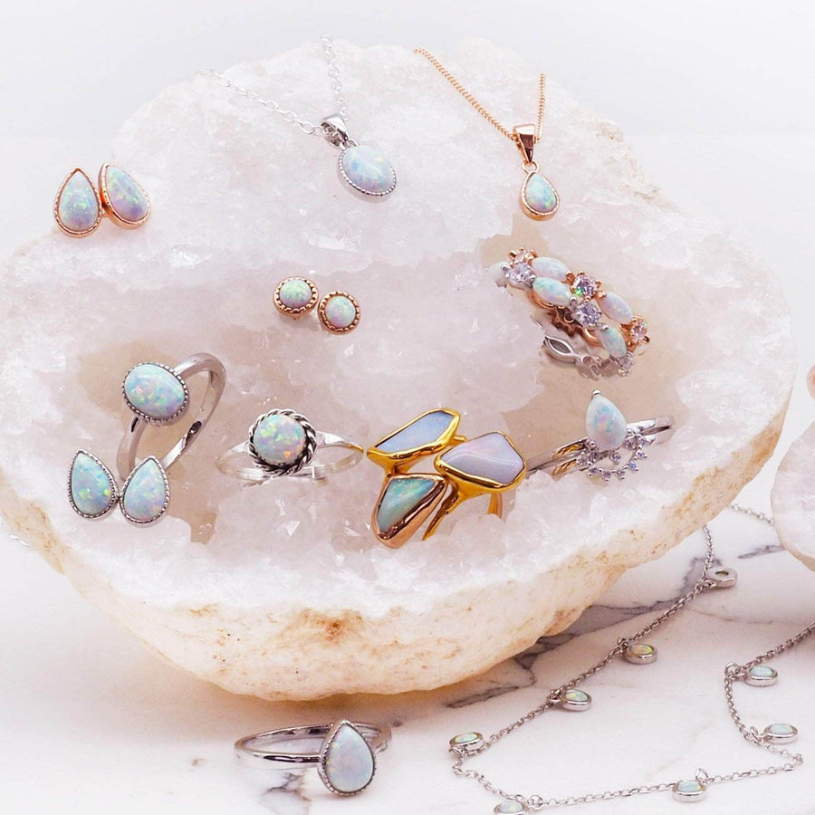 large collection of opal jewellery sitting in large white crystal - womens jewellery by indie and harper