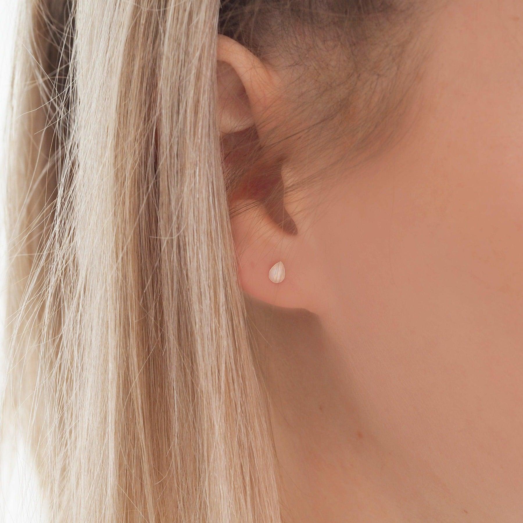 Indie and Harper Dainty droplet white Opal Earrings being worn 
