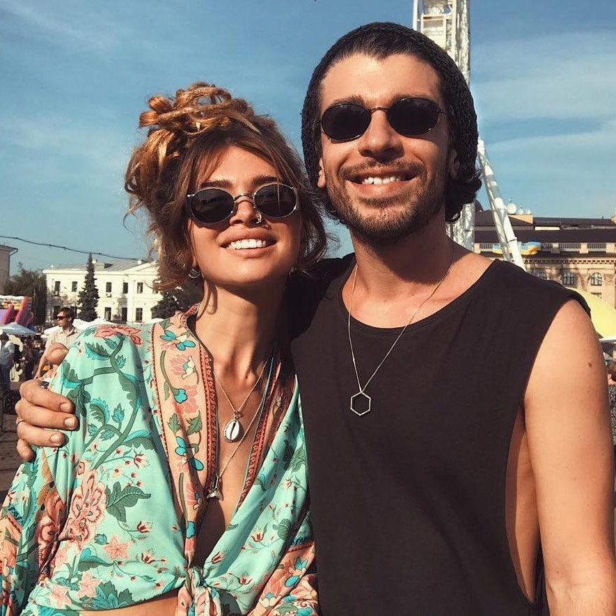 Couple at a festival wearing Sterling Silver Cowrie Shell Necklace