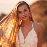 Woman wearing Silver Wave Necklace by Australian jewellery brands indie and harper